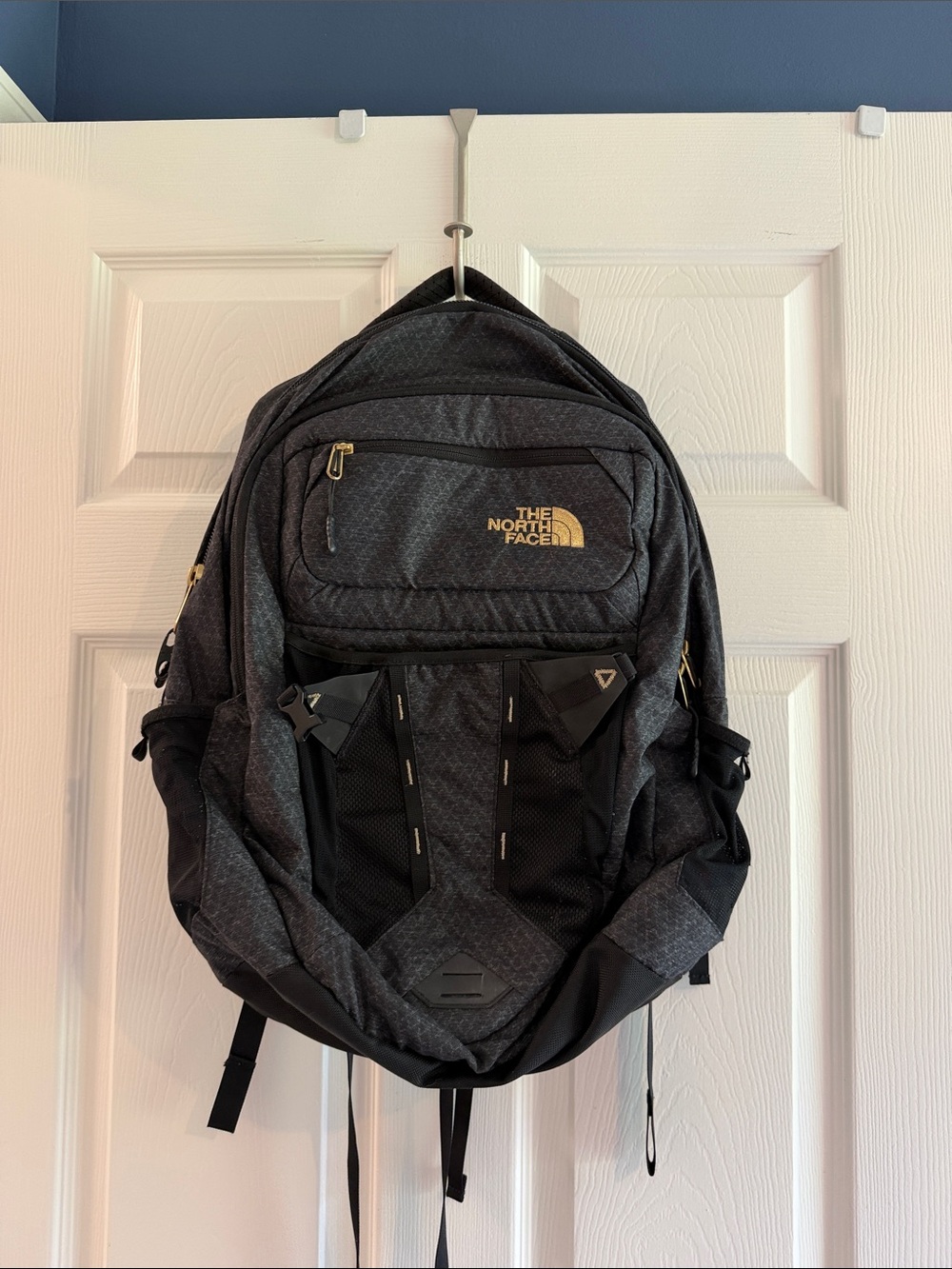 The North Face Men's Charcoal Gray Travel Backpack with Gold Logo